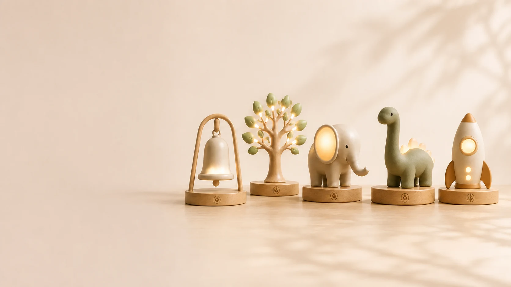The GiveGlow collection: Hope Bell, Growing Tree, Guardian Elephant, Discovery Dinosaur, and Explorer Rocket